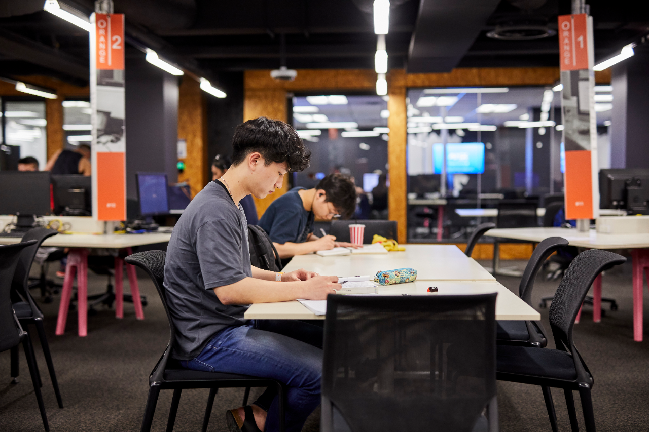 Student studying in the hub